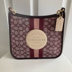 Coach Dempsey Crossbody bag burgundy / pink